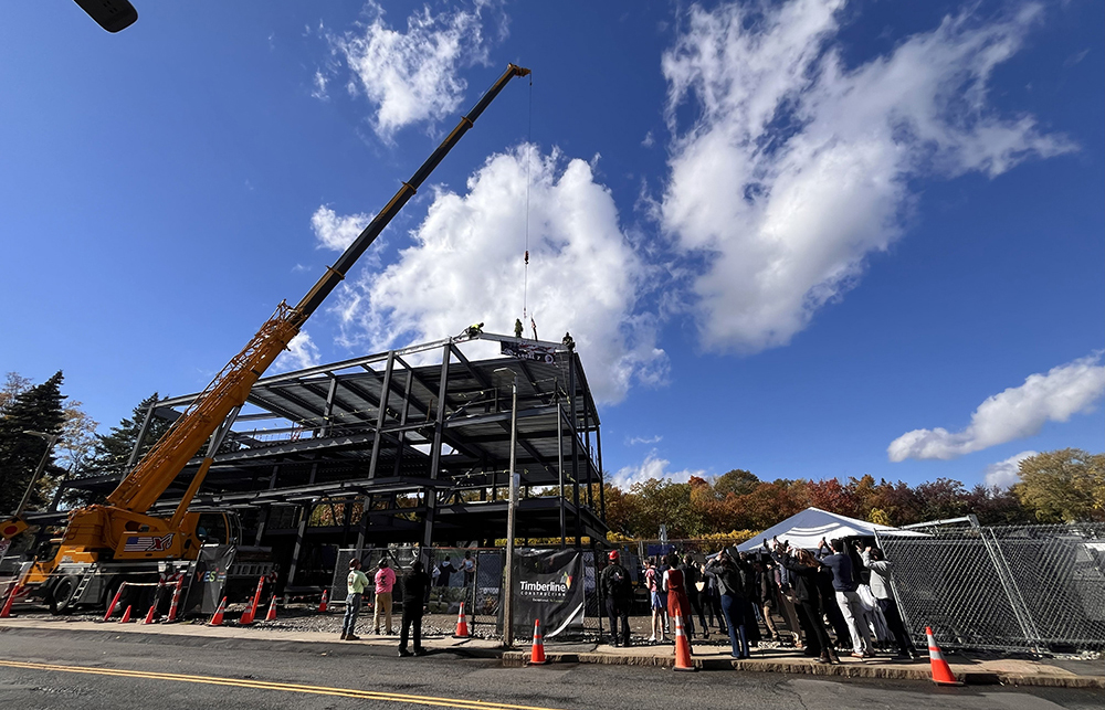 Timberline Construction joins Youth Enrichment Services in beam raising at new facility